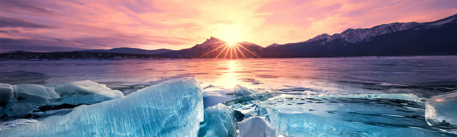 ice floats on ocean viewed during sunrise